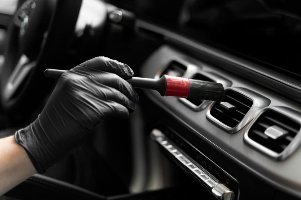 Close-up of a polished car exterior showing the high-gloss finish achieved through professional detailing.